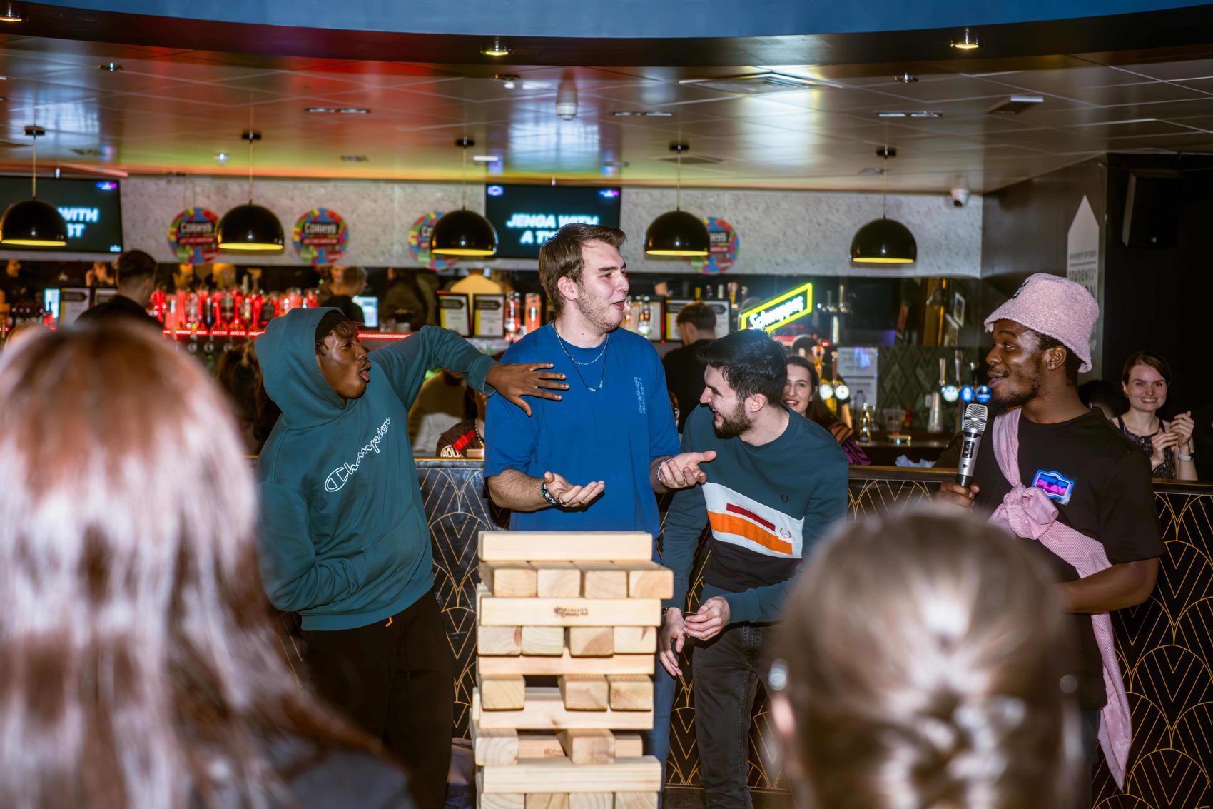 A crowd around giant Jenga